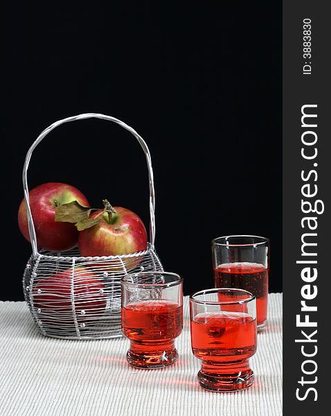 A basket of apple and fresh apple  cider. A basket of apple and fresh apple  cider