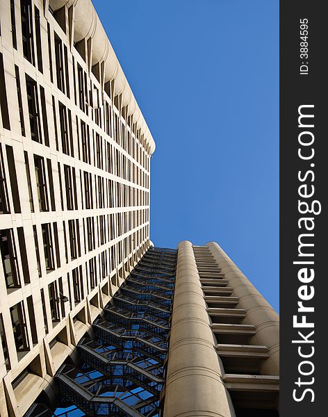 Business Building photographed uward from the bottom. Strong perspective and a lot of space for text.