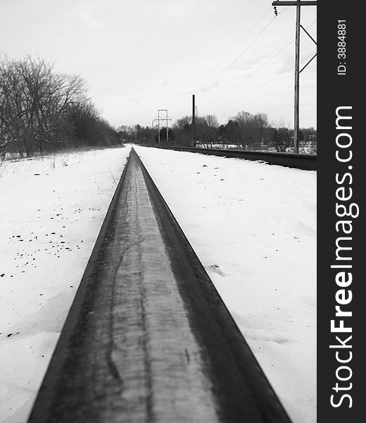 One rail of the train track in winter. One rail of the train track in winter