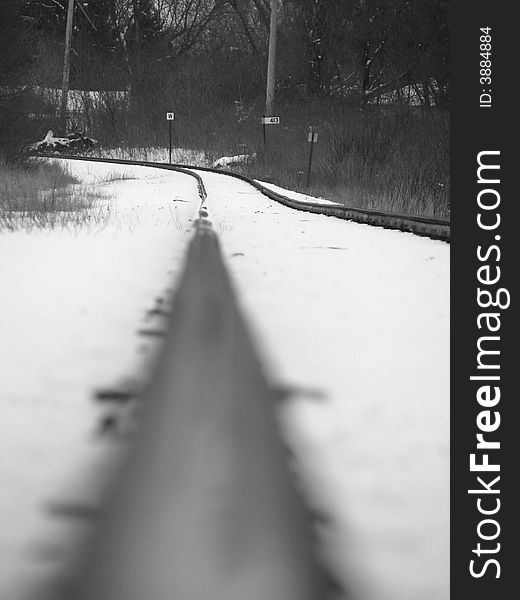 One rail of the train track in winter. One rail of the train track in winter