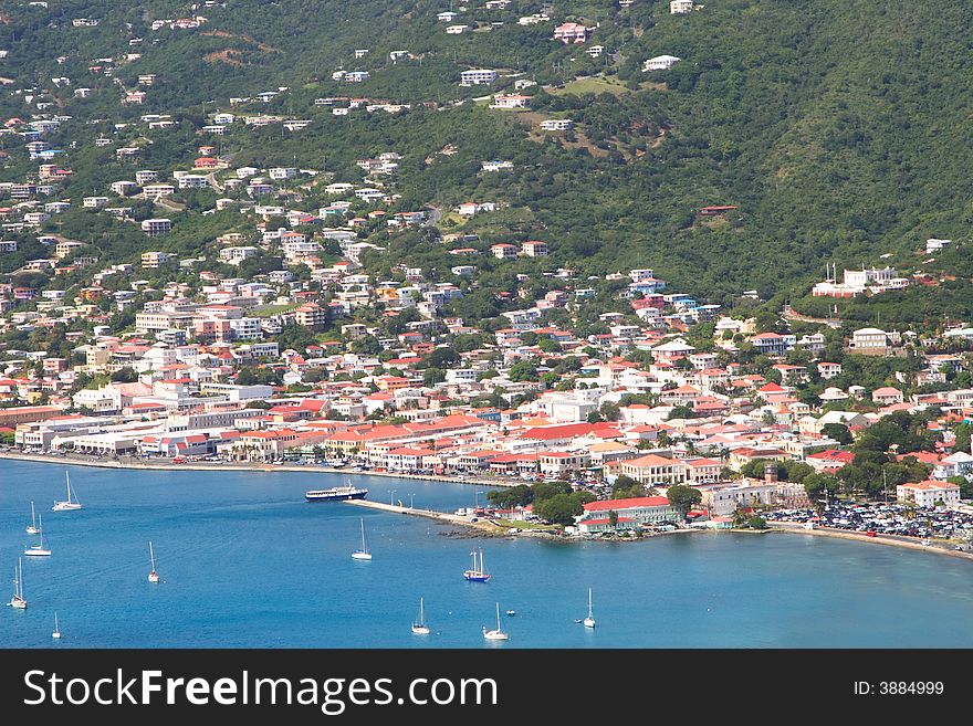 Tropical houses on hill overlooking harbor. St John US Virgin Islands