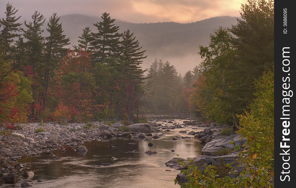 Autumn on Swift river in the white mountains of New Hampshire at dawn in the early autumn. Autumn on Swift river in the white mountains of New Hampshire at dawn in the early autumn