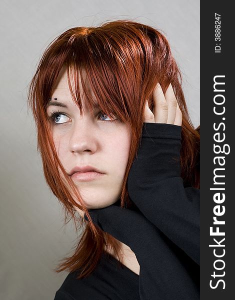 Cute Redhead With Messy Hair Looking Away