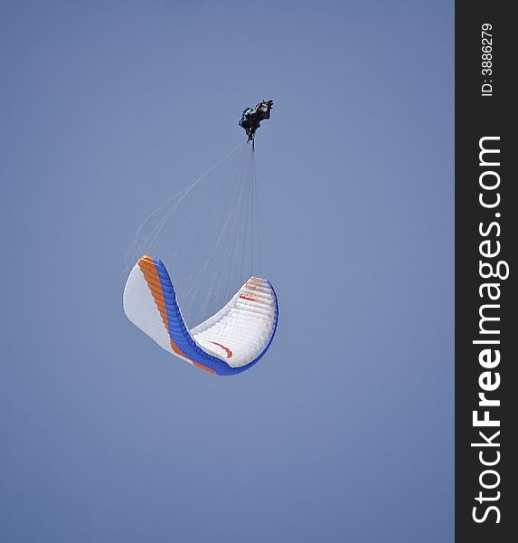 Paraglider doing an acrobatic figure. Paraglider doing an acrobatic figure