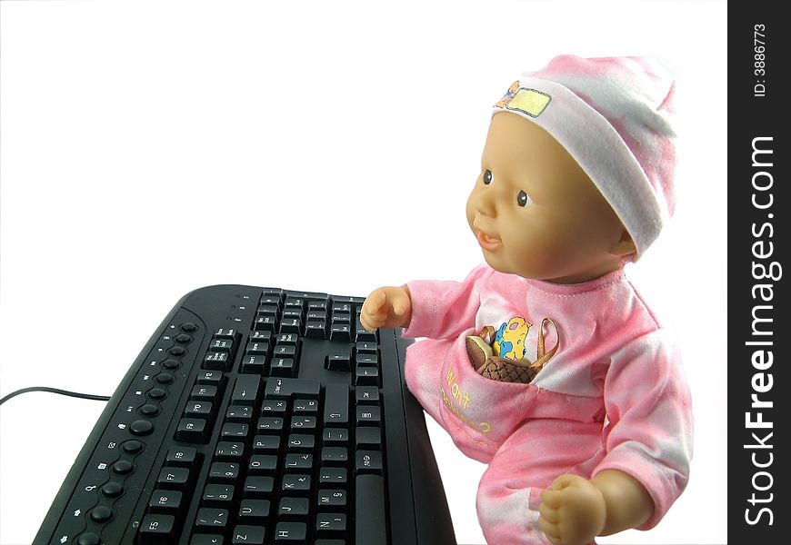 Baby doll and black keyboard. Baby doll and black keyboard