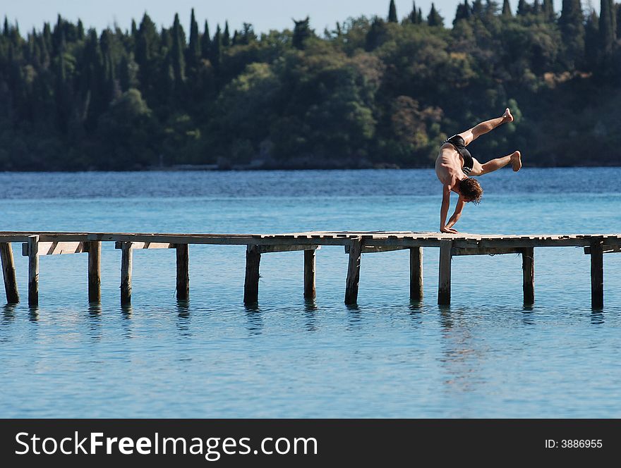 Young man jumping in the water. Young man jumping in the water