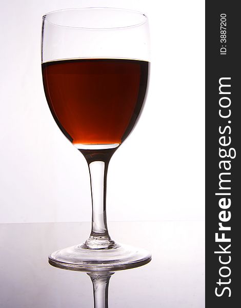 A glass of red wine in white background.