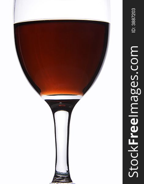 Close up of a glass of red wine in white background.