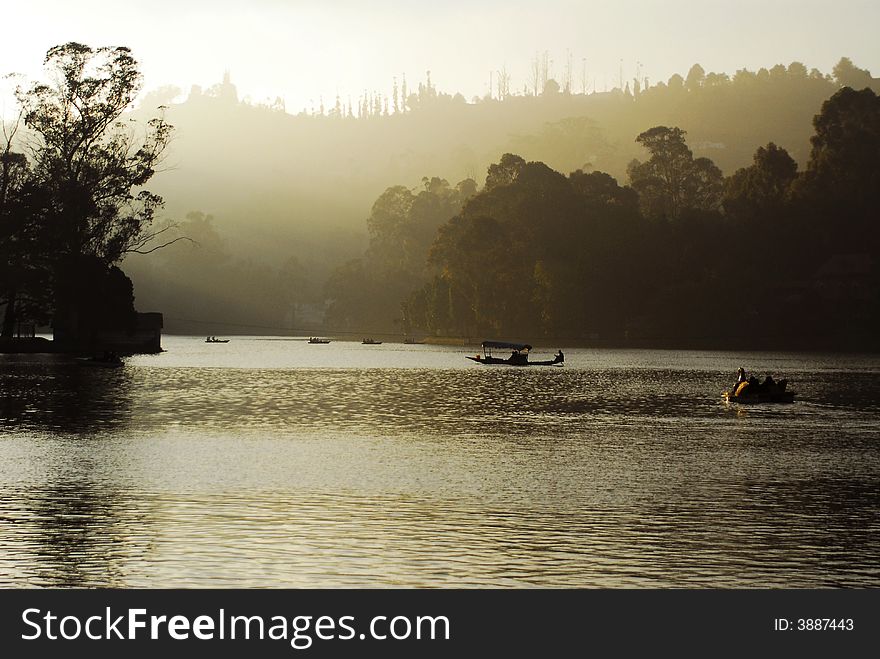 A boat in Kudai Kanal lake in India. A boat in Kudai Kanal lake in India.