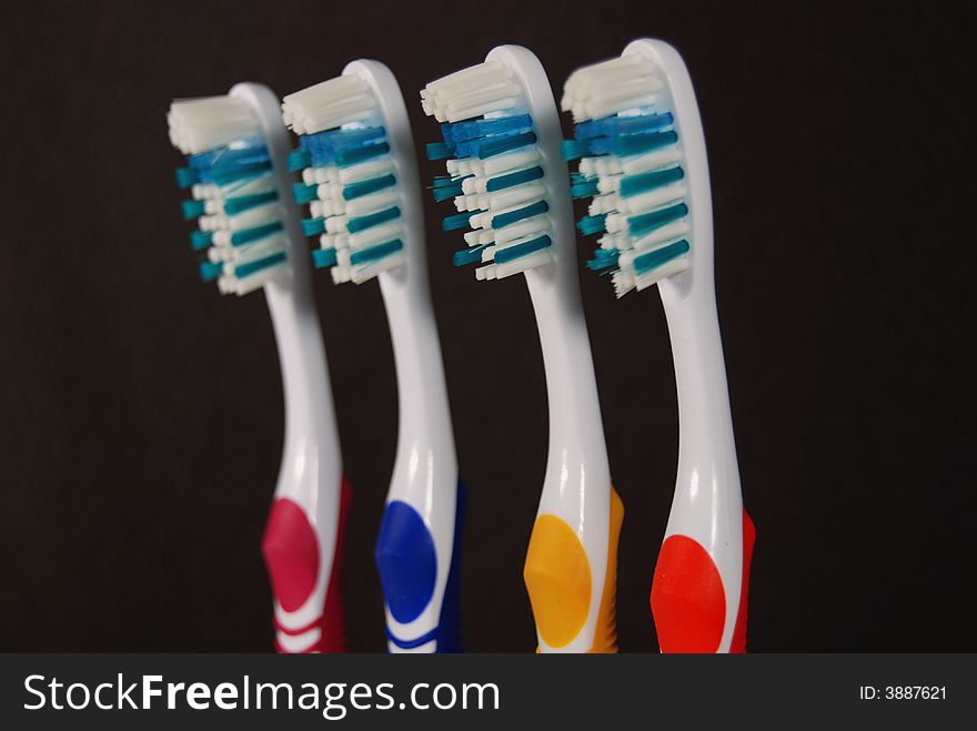 Toothbrushes on a black background. Toothbrushes on a black background.
