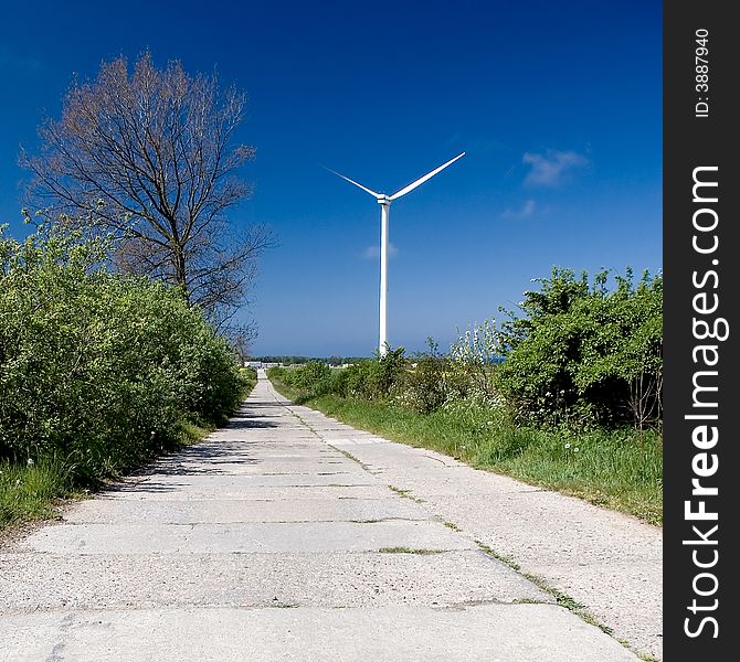 A wind turbine (windmill) standing next to a concrete path, square composition.

<a href='http://www.dreamstime.com/wind-power-with-a-difference.-rcollection4317-resi208938' STYLE='font-size:13px; text-decoration: blink; color:#FF0000'><b>WIND TURBINES WITH DIFFERENCE »</b></a>. A wind turbine (windmill) standing next to a concrete path, square composition.

<a href='http://www.dreamstime.com/wind-power-with-a-difference.-rcollection4317-resi208938' STYLE='font-size:13px; text-decoration: blink; color:#FF0000'><b>WIND TURBINES WITH DIFFERENCE »</b></a>