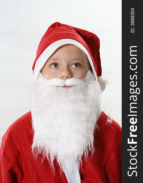 Portrait of the child in a red hat Santa-Claus