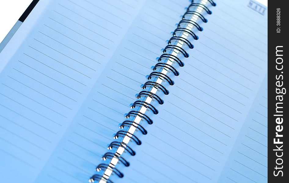 A blank page in a spiral bound notebook, with clipping path.