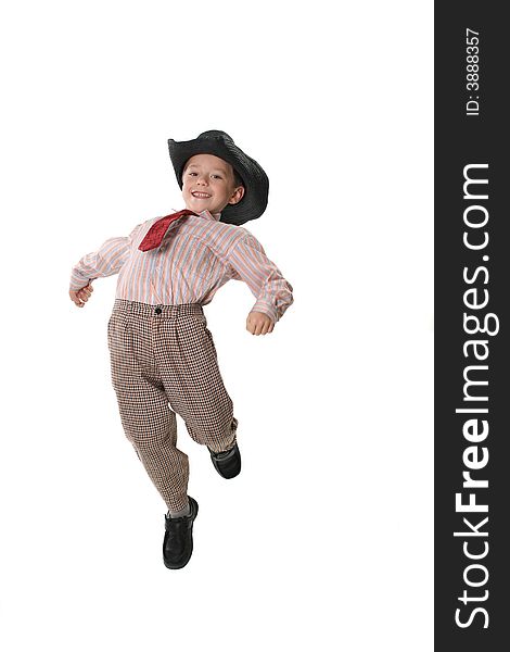 The boy in a tie and a cowboy's hat on a white background