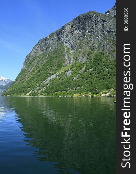 Green water of the Atlantic ocean and power of mountain