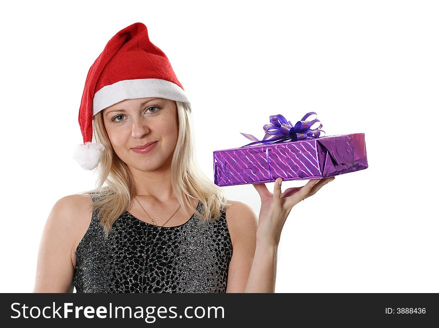 The young woman in red cap Santa with a gift in a hand