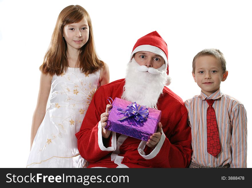 Santa together with two children and a gift on a white background