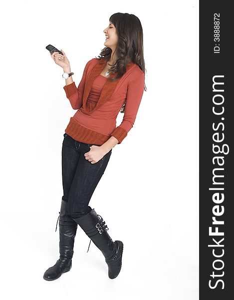 Young brunette girl with mobile phone in hand.