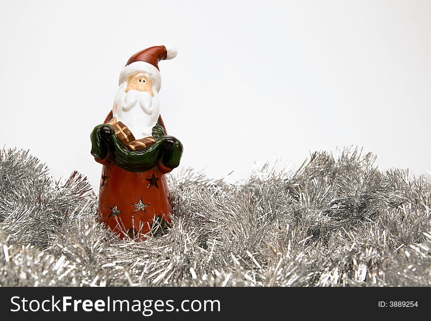 New Year and Christmas decoration with Santa Claus candleholder and tinsel. canon 400d