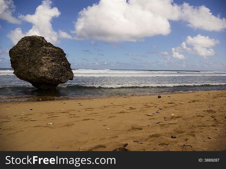 Waves come into shore along a peaceful beach in Barbados. Waves come into shore along a peaceful beach in Barbados