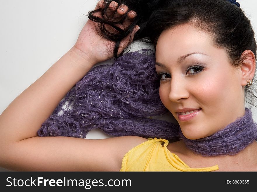 Stylish asian girl lying on white background. Stylish asian girl lying on white background