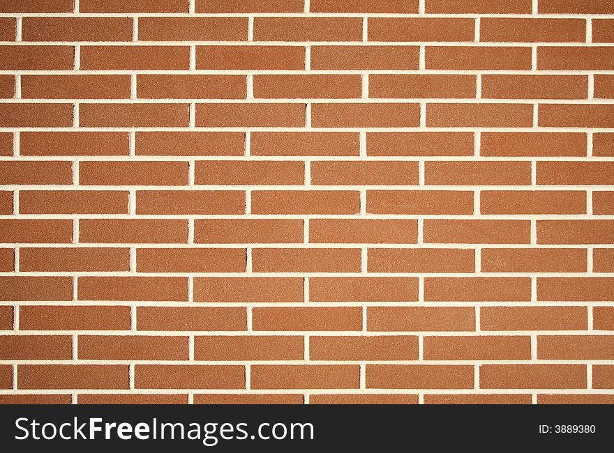 Photo of a plain red brick wall texture. Photo of a plain red brick wall texture