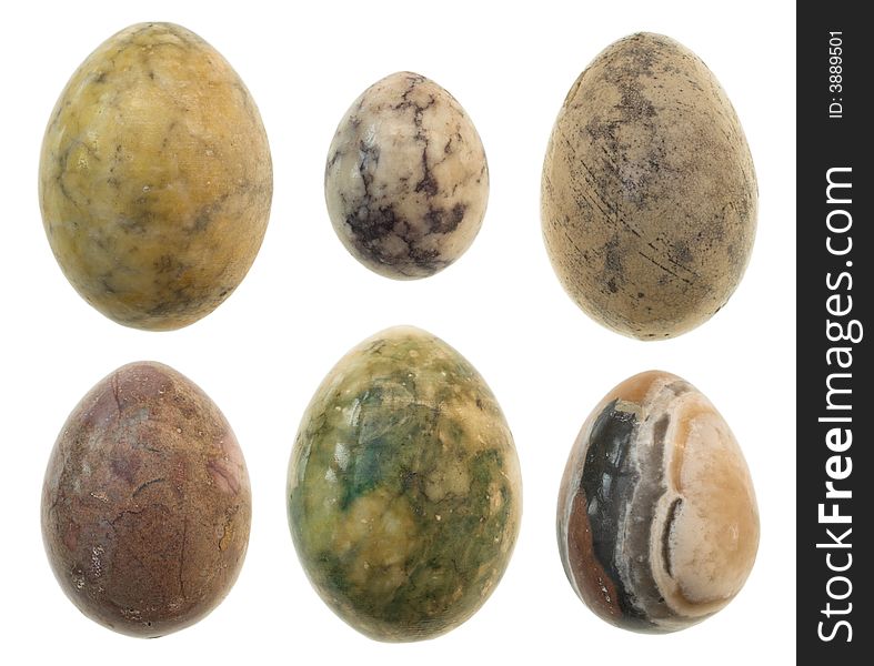 Six different sized marble eggs arranged on white background. Six different sized marble eggs arranged on white background