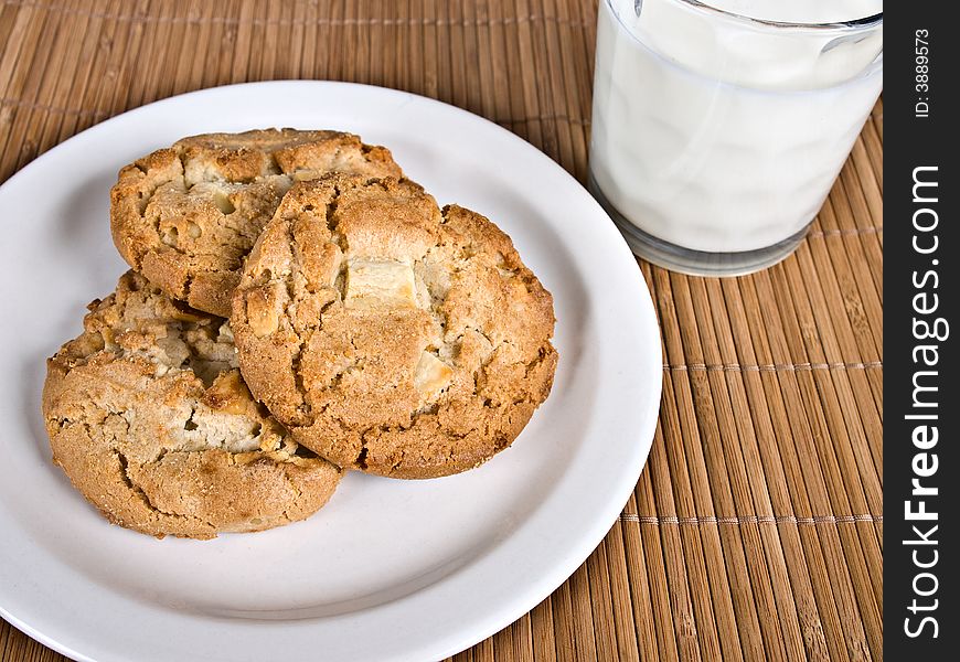 Cookies on a plate with a glass of milk. Cookies on a plate with a glass of milk