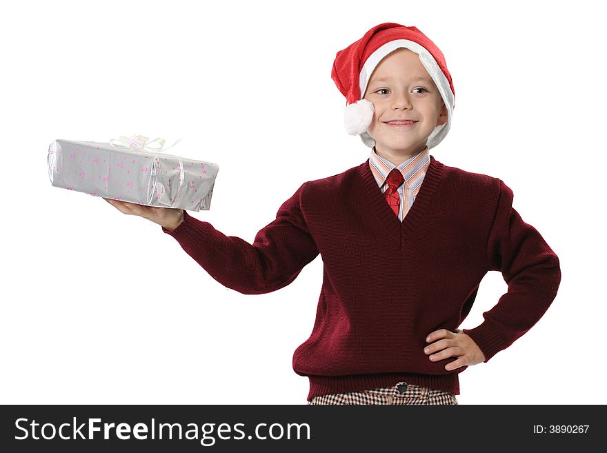 The boy in a sweater and cap Santa holds gift