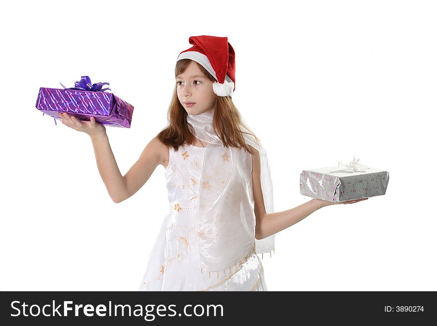 The girl in a white dress and cap Santa holds two gifts