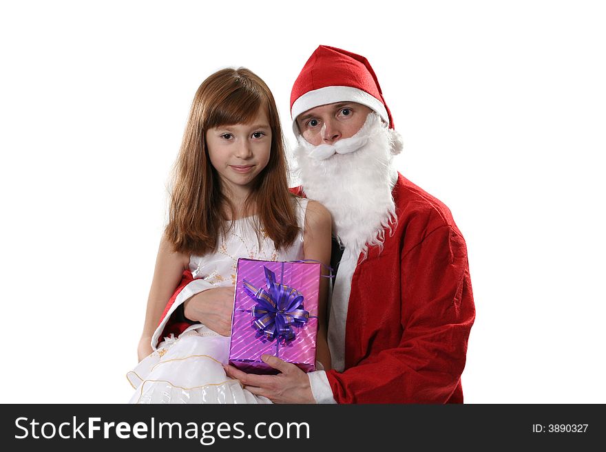 Santa poses with the girl and a gift on a white background. Santa poses with the girl and a gift on a white background