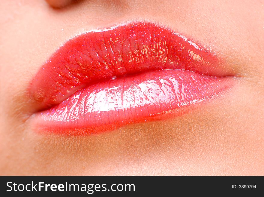 Close-up beautiful shiny pink glamour lips