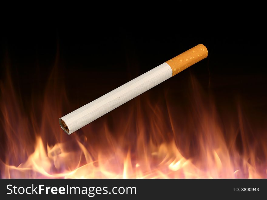 Isolated Cigarette On A Fire Background