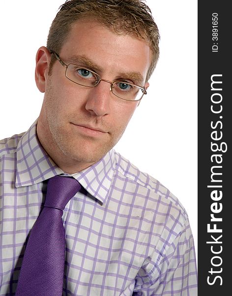 Handsome young businessman, wearing spectacles, check shirt & lilac tie, vertical format,isolated on white