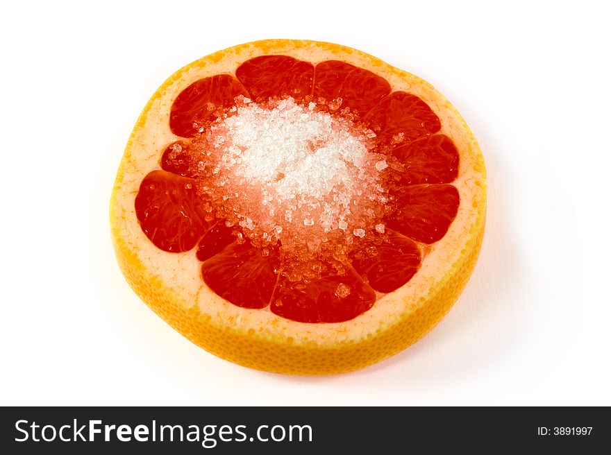 Orange slice with sugar on white background