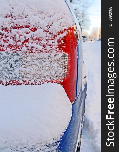 Car bumper covered by snow