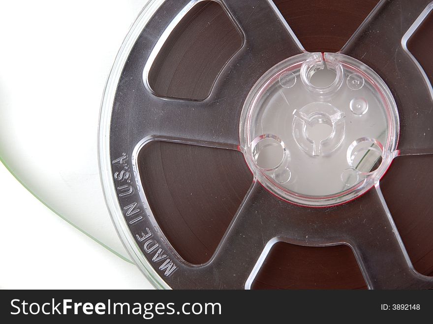 Reel-to-reel audio tape spool, isolated on white. Reel-to-reel audio tape spool, isolated on white