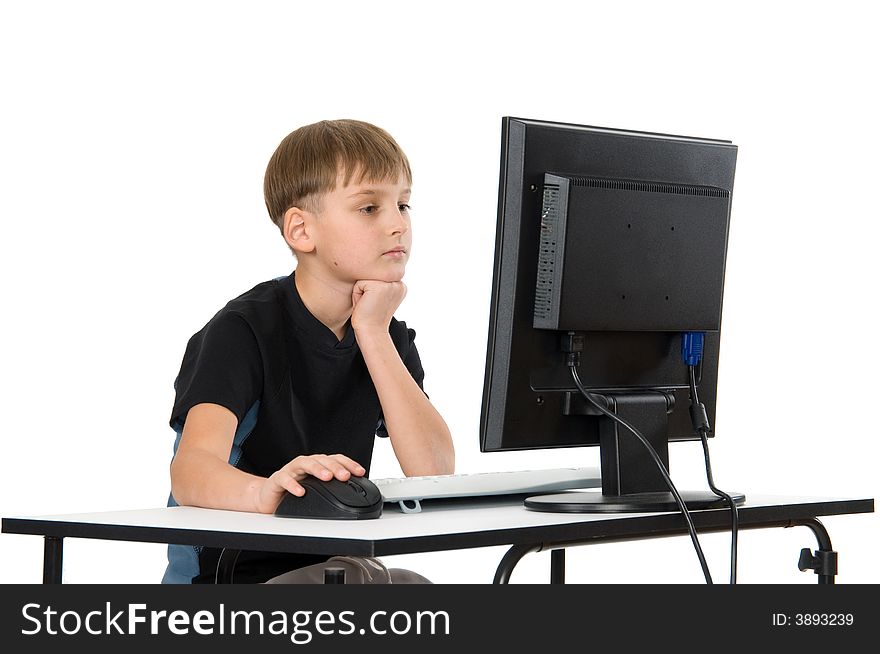 Boy on computer with cordless mouse and keyboard. Boy on computer with cordless mouse and keyboard.