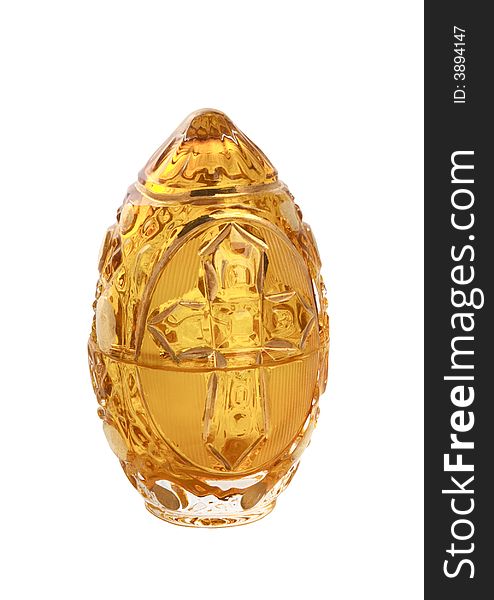 Glass yellow easter egg with a cross isolated on white. Glass yellow easter egg with a cross isolated on white