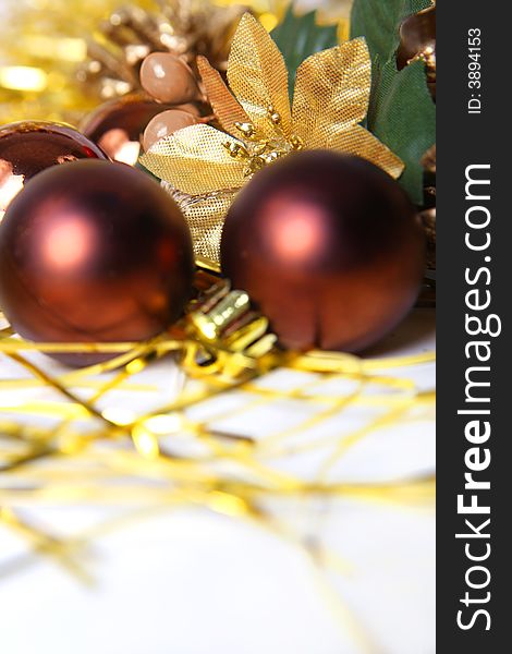 Christmas ornament, brown balls and gold background
