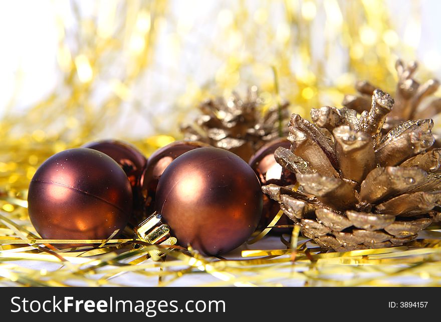Christmas ornament, brown balls and gold background