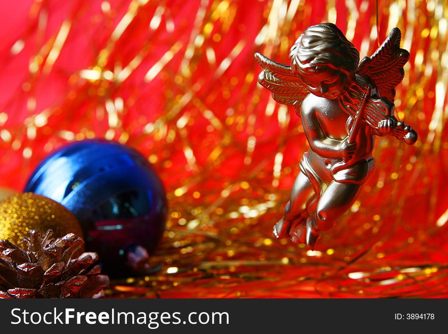 Christmas ornament, angel and red=gold background