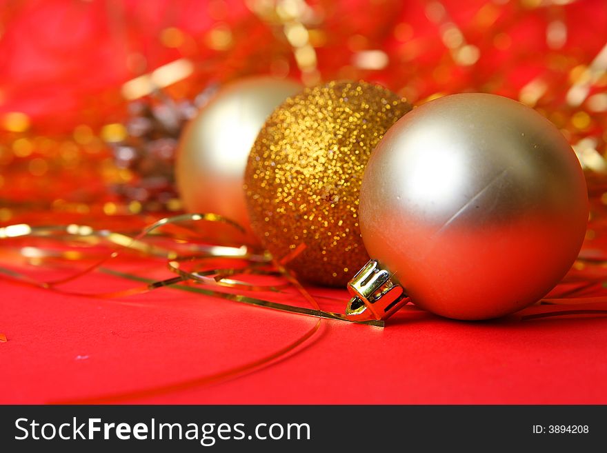 Christmas ornament, gold balls and red background