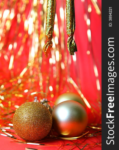 Christmas ornament, gold balls and red background