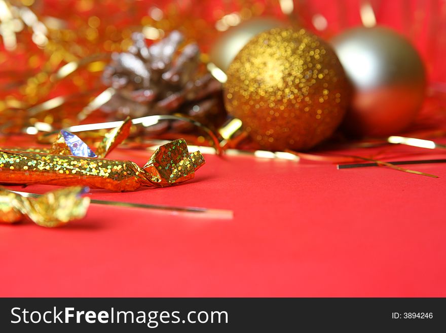 Christmas ornament, gold balls and red background