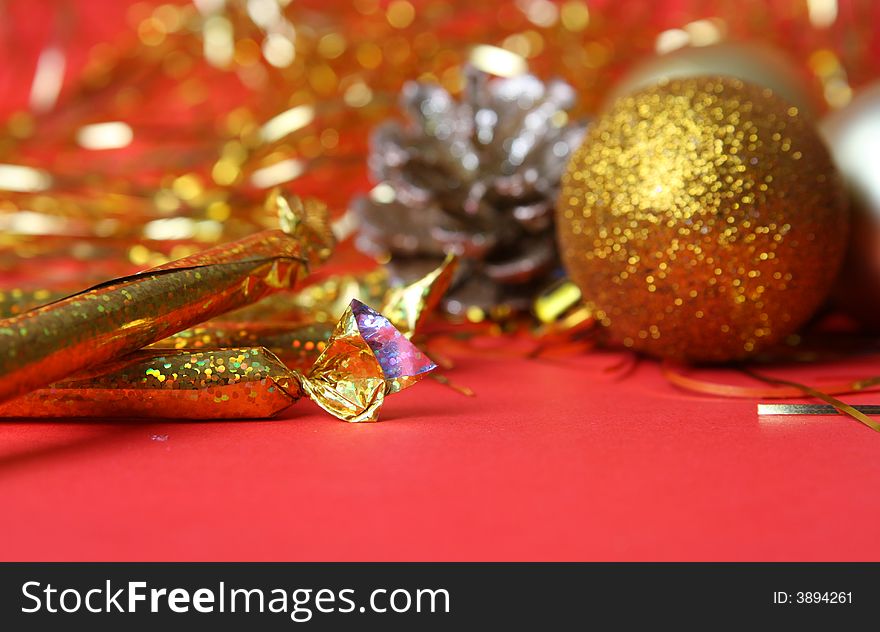 Christmas ornament, gold balls and red background