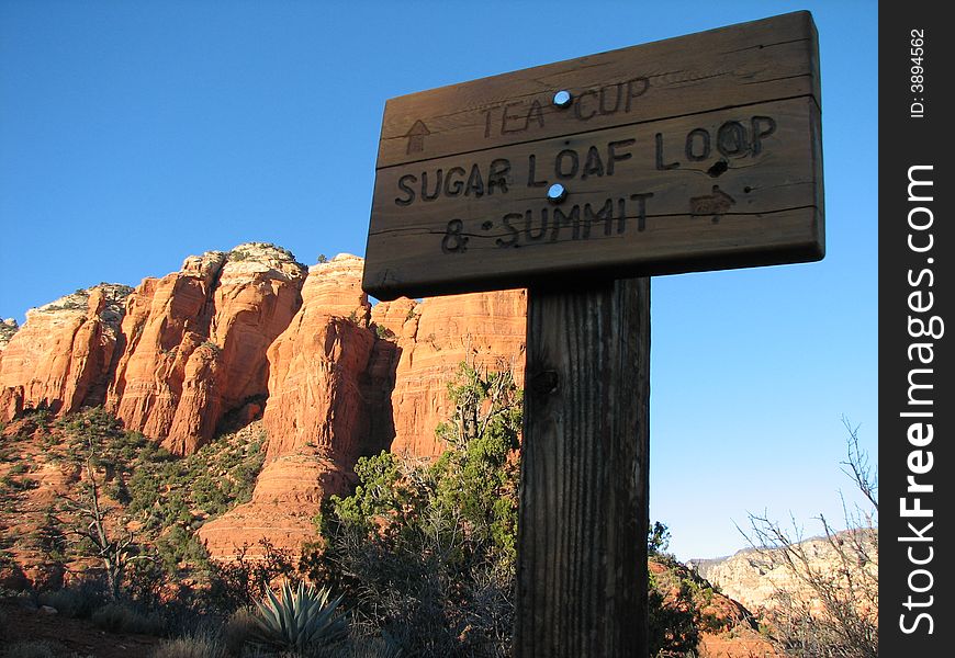 Trail sign in sedona's red rock forest. Trail sign in sedona's red rock forest.