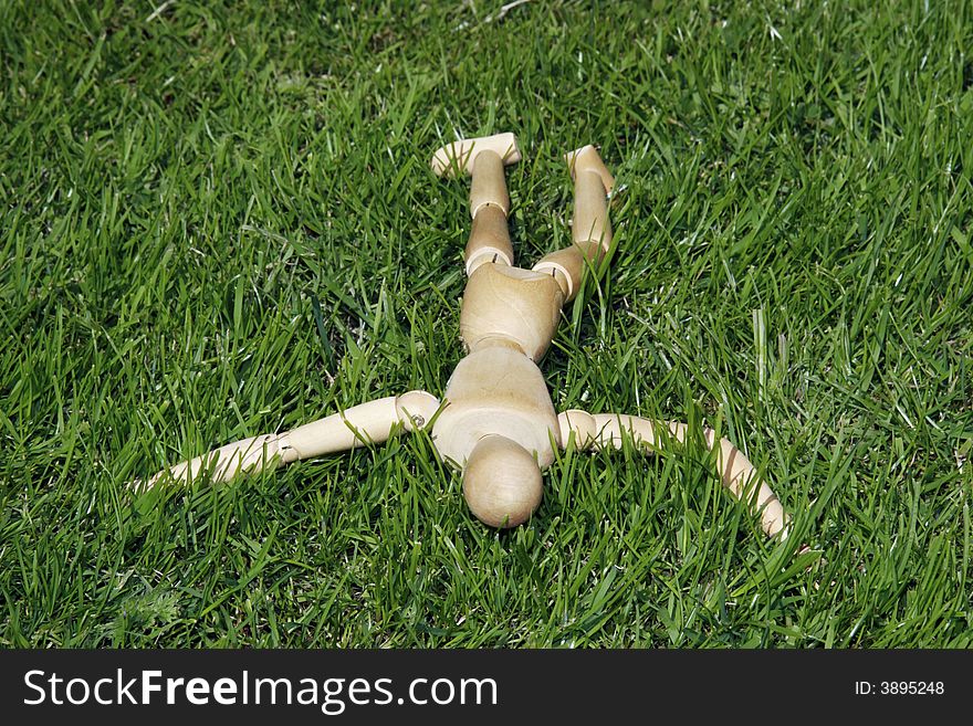 Art model man lying in the grass. Art model man lying in the grass