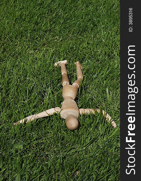 Art model man lying in the grass. Art model man lying in the grass