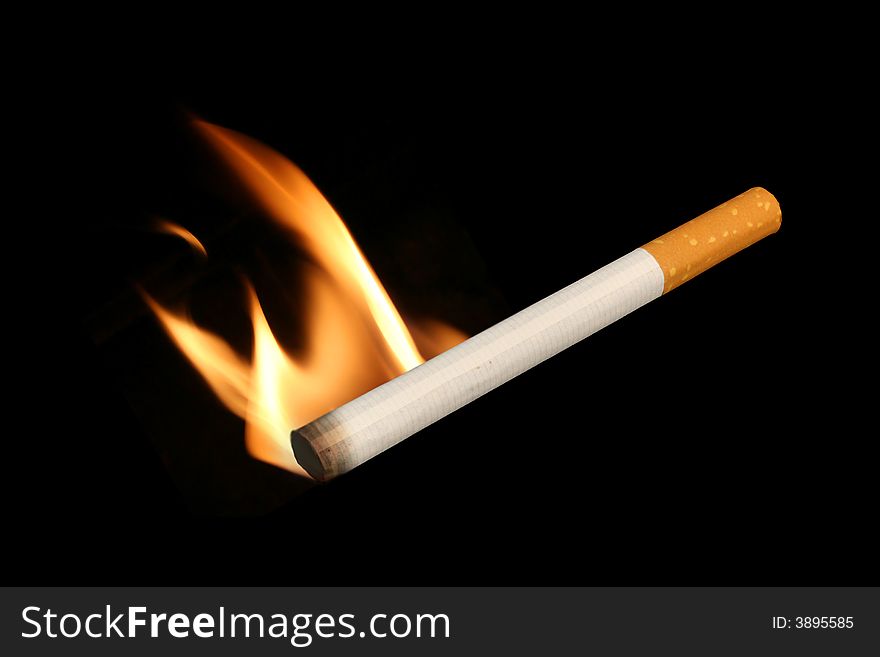 Isolated Cigarette On A Black Background